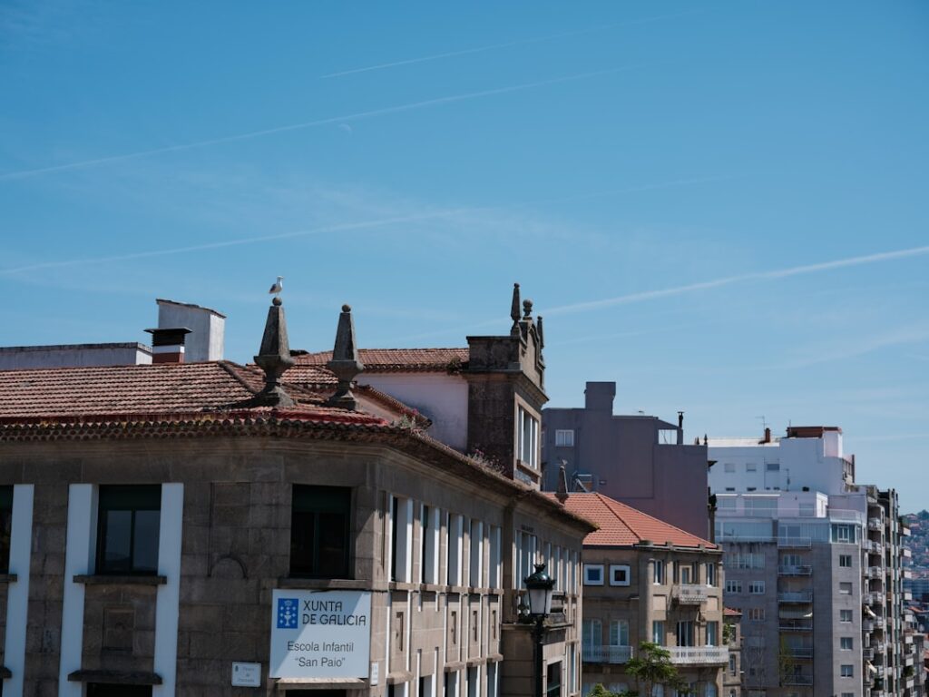 a row of buildings with a blue sky in the background